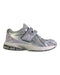 A Silver Sneakers from New Balance in size 7Y for girl. (Front View)