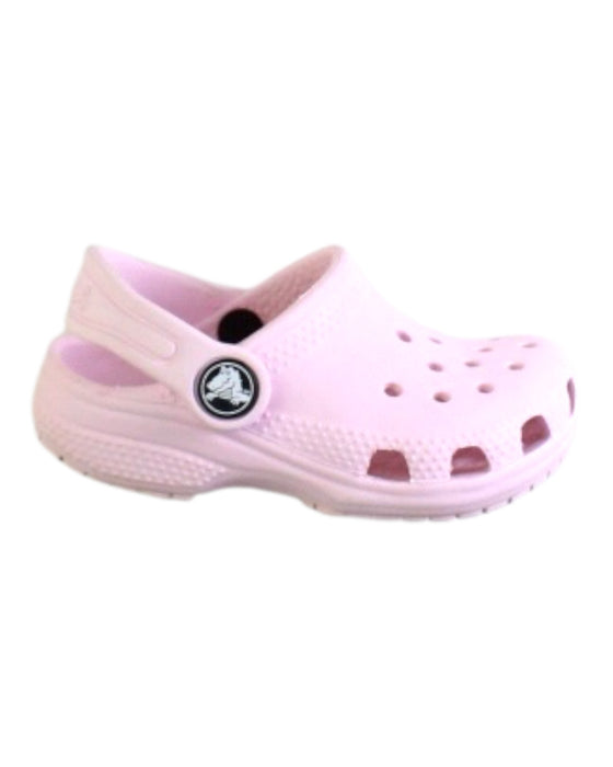 A Pink Slip Ons from Crocs in size 12-18M for girl. (Front View)