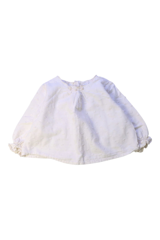 A White Long Sleeve Tops from Nanos in size 6-12M for girl. (Front View)