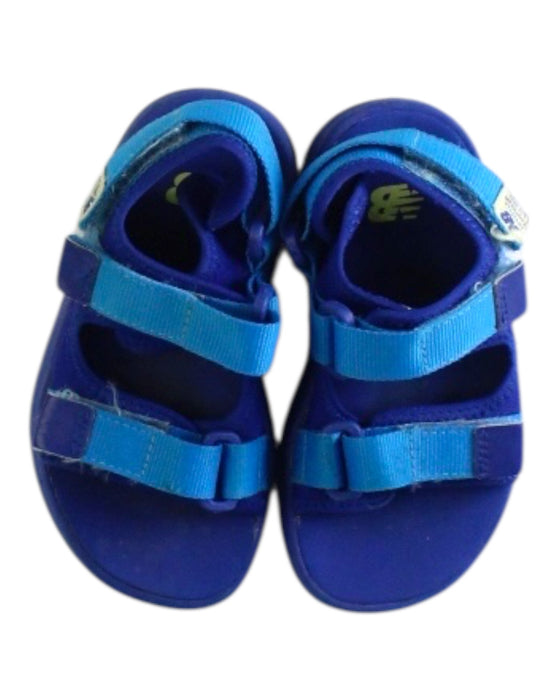 A Blue Sandals from New Balance in size 5T for boy. (Back View)