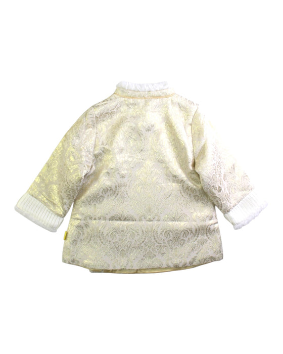 A White Coats from Mides in size 12-18M for girl. (Back View)