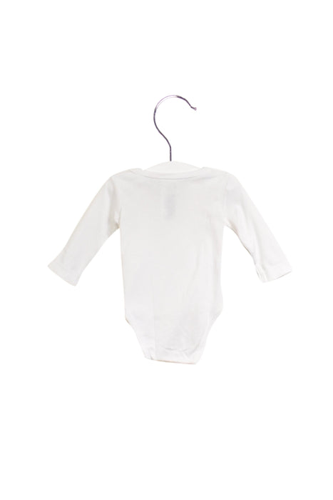 A White Long Sleeve Bodysuits from Jacadi in size 3-6M for girl. (Front View)