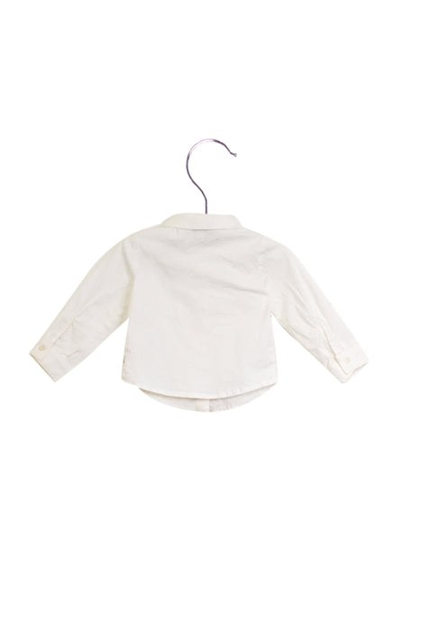 A White Shirts from Armani in size 3-6M for girl. (Back View)