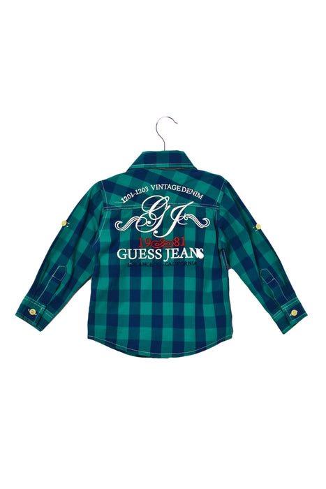 A Blue Shirts from Guess in size 12-18M for boy. (Back View)