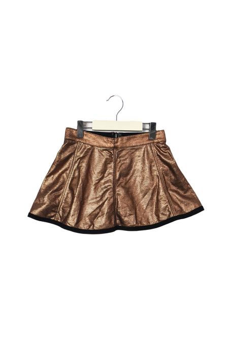 A Gold Short Skirts from IKKS in size 5T for girl. (Front View)