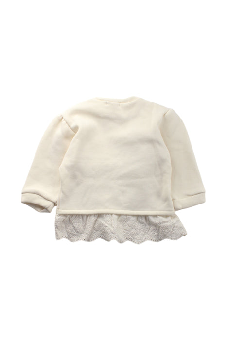 A Ivory Long Sleeve Tops from Aosta in size 3T for girl. (Back View)