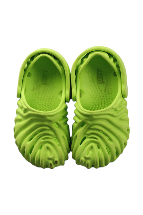 A Green Clogs from Crocs in size 18-24M for neutral. (Back View)