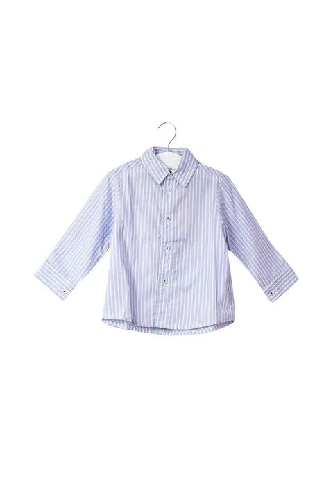 A Blue Shirts from La Coqueta in size 6-12M for neutral. (Front View)