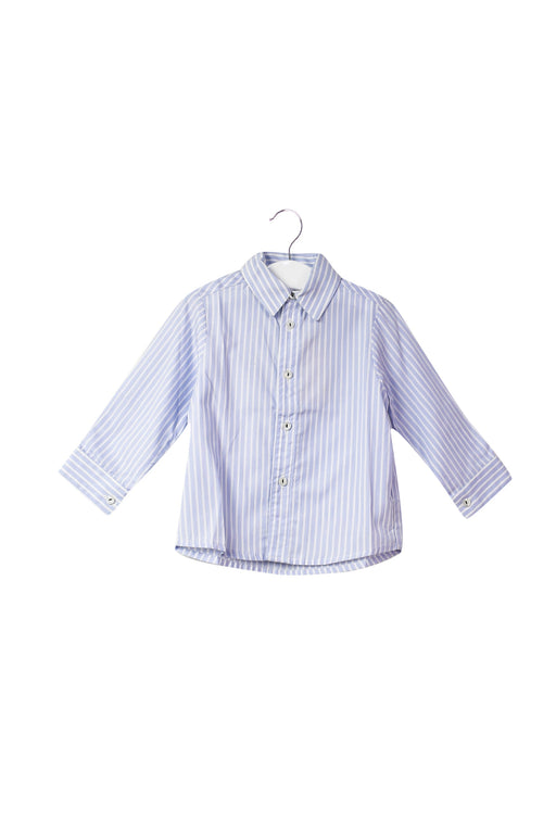 A Blue Shirts from La Coqueta in size 6-12M for neutral. (Front View)