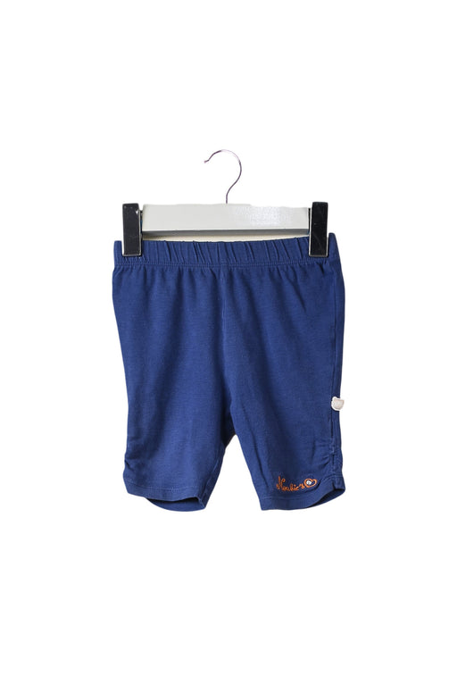 A Blue Shorts from Noukie's in size 6-12M for girl. (Front View)