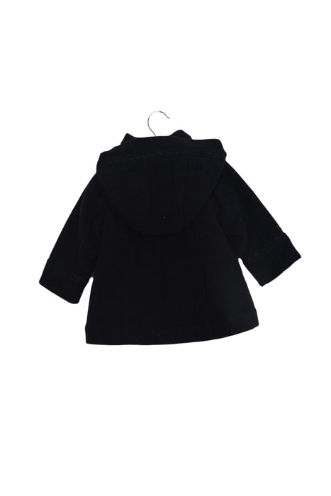 A Navy Coats from Jacadi in size 6-12M for girl. (Back View)