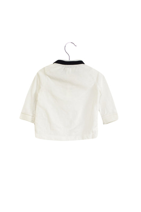 A White Long Sleeve Polos from Jacadi in size 3-6M for boy. (Back View)