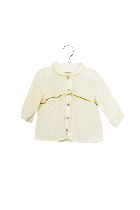 A Ivory Long Sleeve Tops from Marlot Paris in size 0-3M for girl. (Front View)