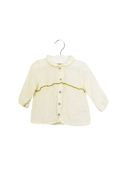 A Ivory Long Sleeve Tops from Marlot Paris in size 0-3M for girl. (Front View)