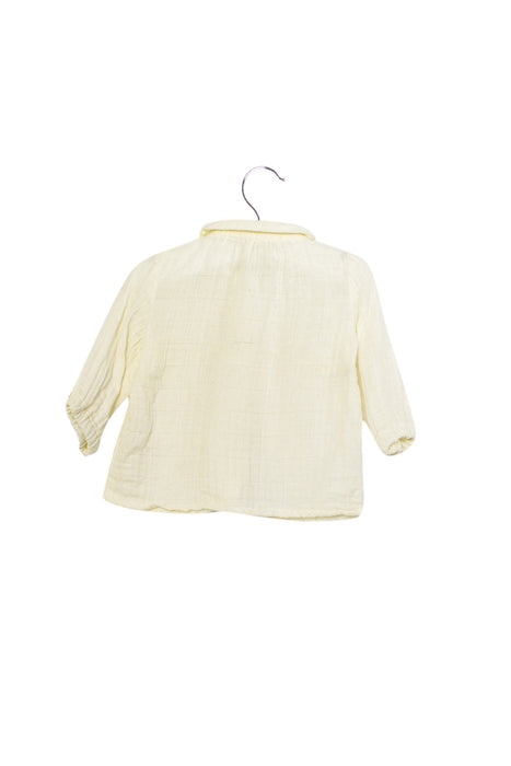 A Ivory Long Sleeve Tops from Marlot Paris in size 0-3M for girl. (Back View)