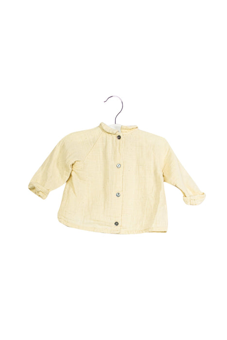 A Ivory Long Sleeve Tops from Apaches Collections in size 3-6M for girl. (Front View)