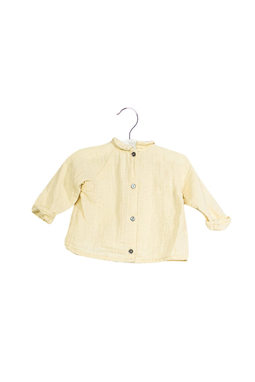 A Ivory Long Sleeve Tops from Apaches Collections in size 3-6M for girl. (Front View)