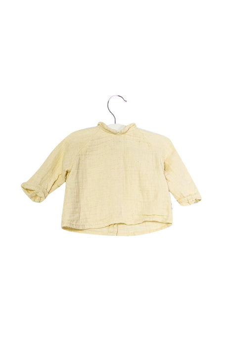 A Ivory Long Sleeve Tops from Apaches Collections in size 3-6M for girl. (Back View)