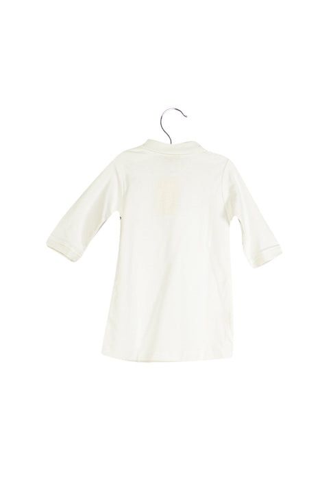 A Ivory Long Sleeve Dresses from Ovale in size 6-12M for girl. (Back View)