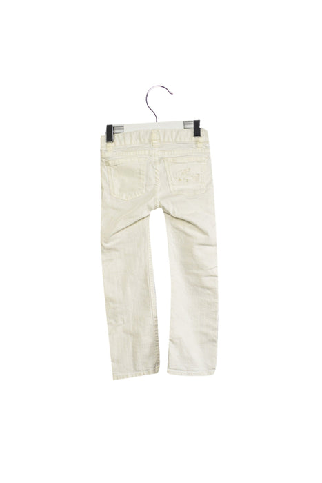 A White Jeans from Lacoste in size 4T for girl. (Back View)