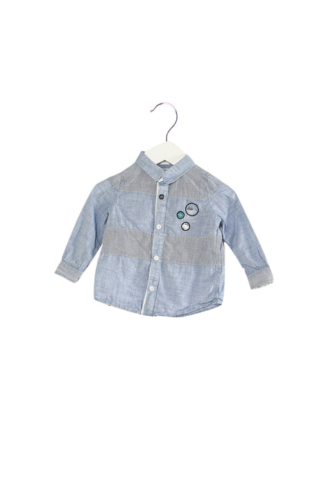 A Blue Shirts from IKKS in size 6-12M for boy. (Front View)
