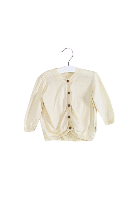 A Ivory Cardigans from Natures Purest in size 12-18M for neutral. (Front View)