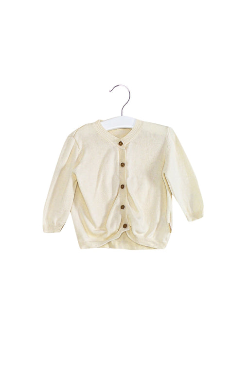 A Ivory Cardigans from Natures Purest in size 12-18M for neutral. (Front View)