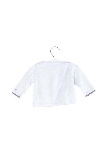 A White Cardigans from Jacadi in size 3-6M for girl. (Back View)