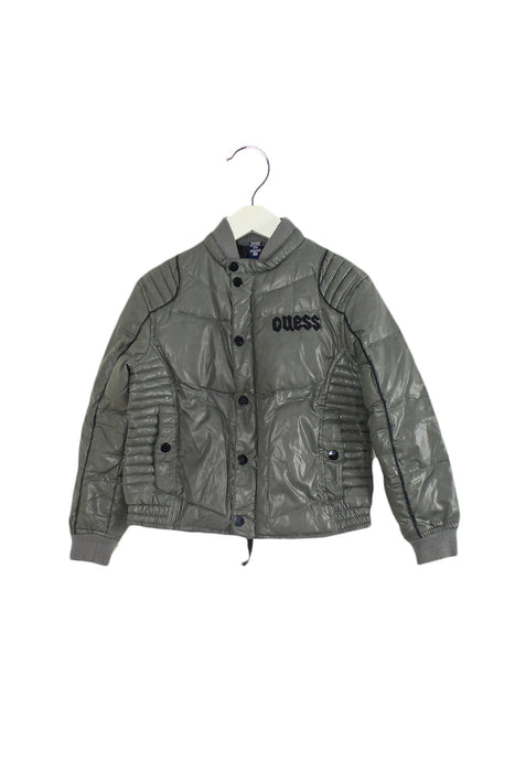 A Grey Puffer/Quilted Jackets from Guess in size 6T for boy. (Front View)