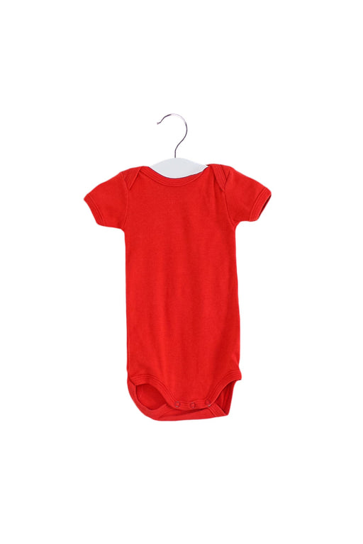A Red Short Sleeve Bodysuits from Petit Bateau in size 0-3M for girl. (Front View)