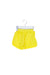 A Yellow Swim Shorts from Seed in size 3-6M for girl. (Front View)