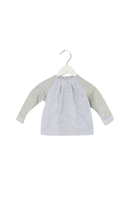 A Grey Crewneck Sweatshirts from DKNY in size 6-12M for girl. (Front View)