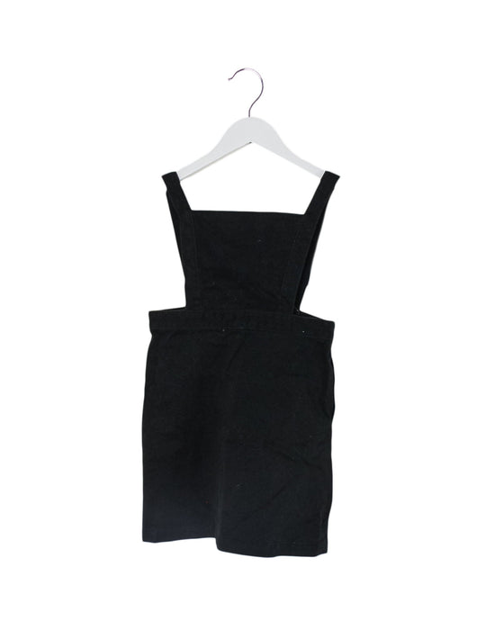 A Black Overall Dresses from Comme Ca Du Mode in size 4T for girl. (Front View)