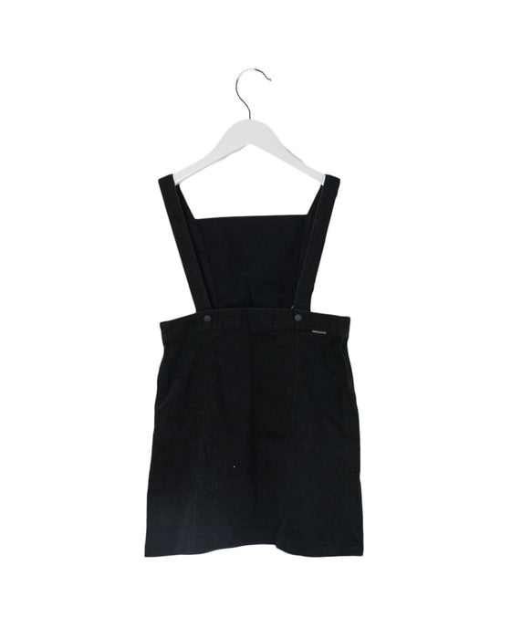 A Black Overall Dresses from Comme Ca Du Mode in size 4T for girl. (Back View)