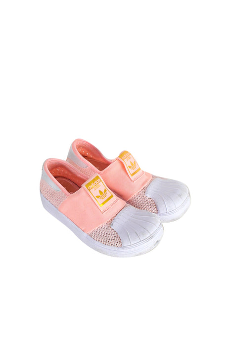 A Orange Slip Ons from Adidas in size 5T for girl. (Front View)