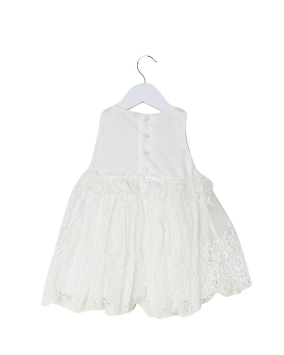 A White Sleeveless Dresses from Miniclasix in size 6-12M for girl. (Back View)