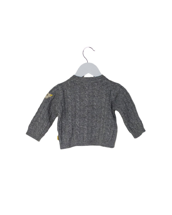 A Grey Cardigans from Steiff in size 0-3M for boy. (Back View)