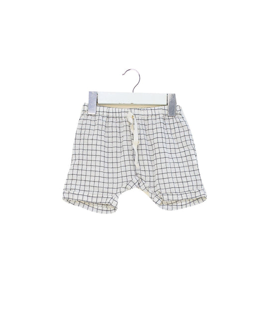 A White Shorts from Emile et Ida in size 3-6M for neutral. (Front View)