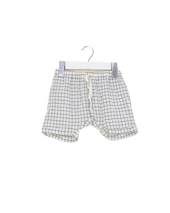 A White Shorts from Emile et Ida in size 3-6M for neutral. (Front View)