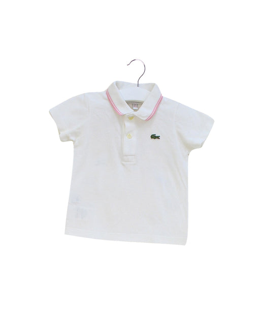 A White Short Sleeve Polos from Lacoste in size 6-12M for girl. (Front View)
