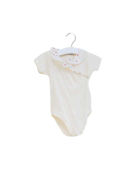 A Ivory Short Sleeve Bodysuits from Dior in size 6-12M for girl. (Front View)