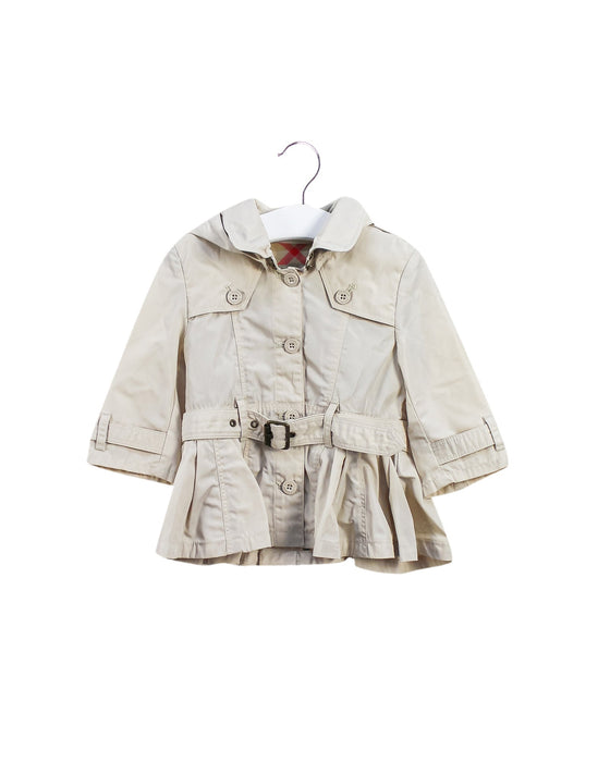 A Beige Coats from Burberry in size 6-12M for girl. (Front View)