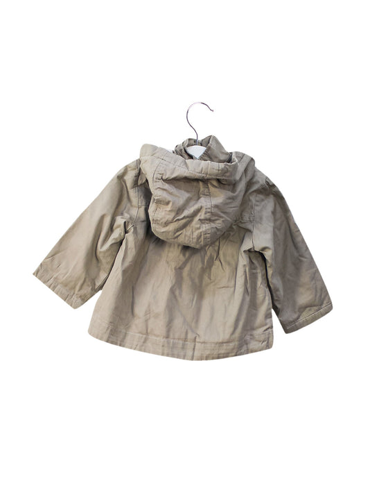 A Grey Lightweight Jackets from Jacadi in size 6-12M for girl. (Back View)