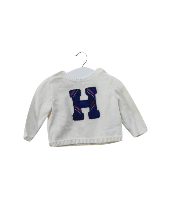 A Ivory Knit Sweaters from Tommy Hilfiger in size 6-12M for girl. (Front View)