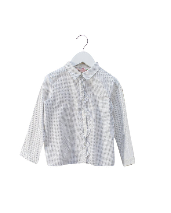 A Blue Shirts from Bonpoint in size 4T for girl. (Front View)