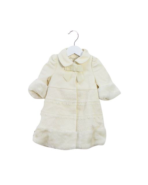 A Ivory Coats from Nicholas & Bears in size 6-12M for girl. (Front View)