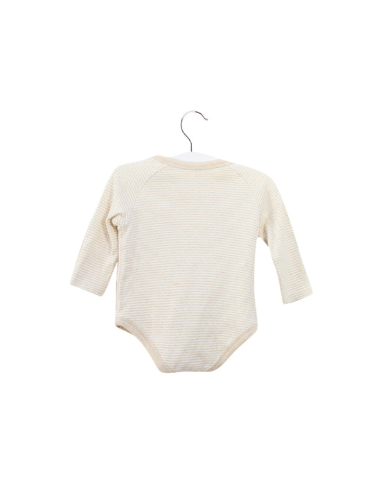 A Beige Long Sleeve Bodysuits from Natures Purest in size 3-6M for girl. (Back View)