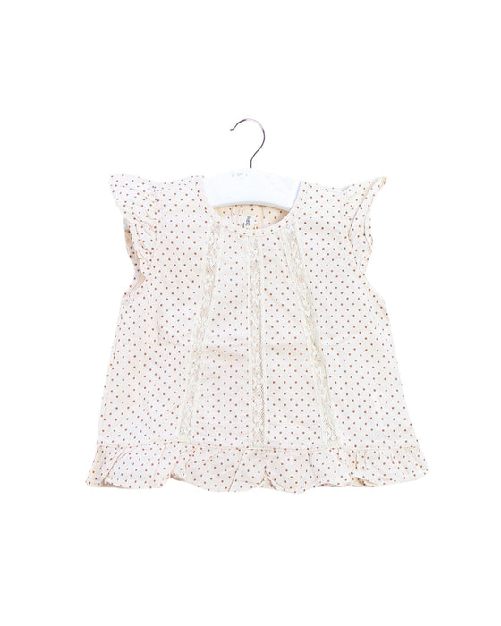 A Peach Sleeveless Tops from Babe & Tess in size 3-6M for girl. (Front View)