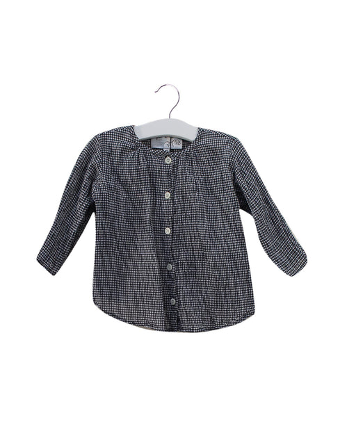 A Black Long Sleeve Tops from Agnes b. in size 6-12M for girl. (Front View)