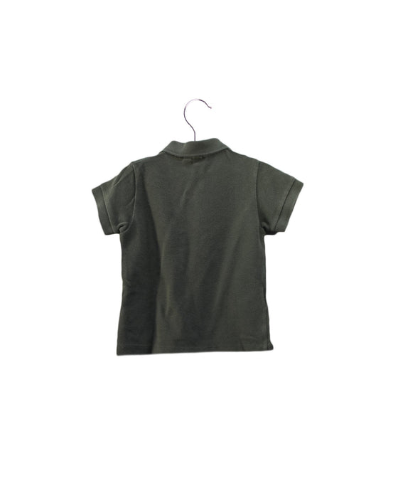 A Green Short Sleeve Polos from Lacoste in size 6-12M for boy. (Back View)